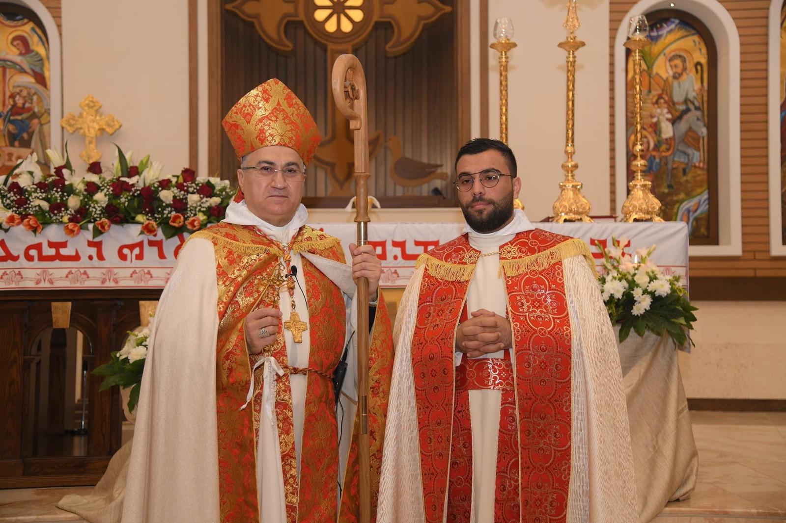 Fr Savio Handula with his bishop